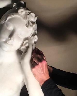 unnamed (1) Person taking care og the awakening of flora statue